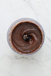 Smooth homemade chocolate peanut butter in a food processor.