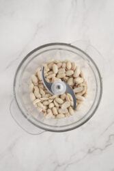 Dry-roasted peanuts in a food processor for homemade peanut butter.