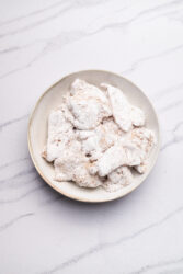 Chicken pieces coated in potato starch for Karaage Recipe.