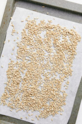 Sunflower seeds spread on a baking sheet for the Sunflower Seed Butter Recipe.