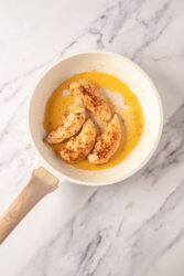 Browning chicken breasts in a skillet for Chicken Lazone.