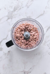Finely chopped ham in a food processor for deviled ham.