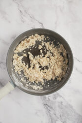 Cooking a roux for ham croquettes in a skillet.