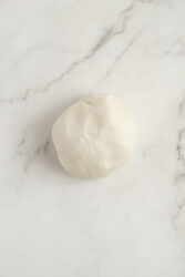 A smooth ball of dough for pork buns.