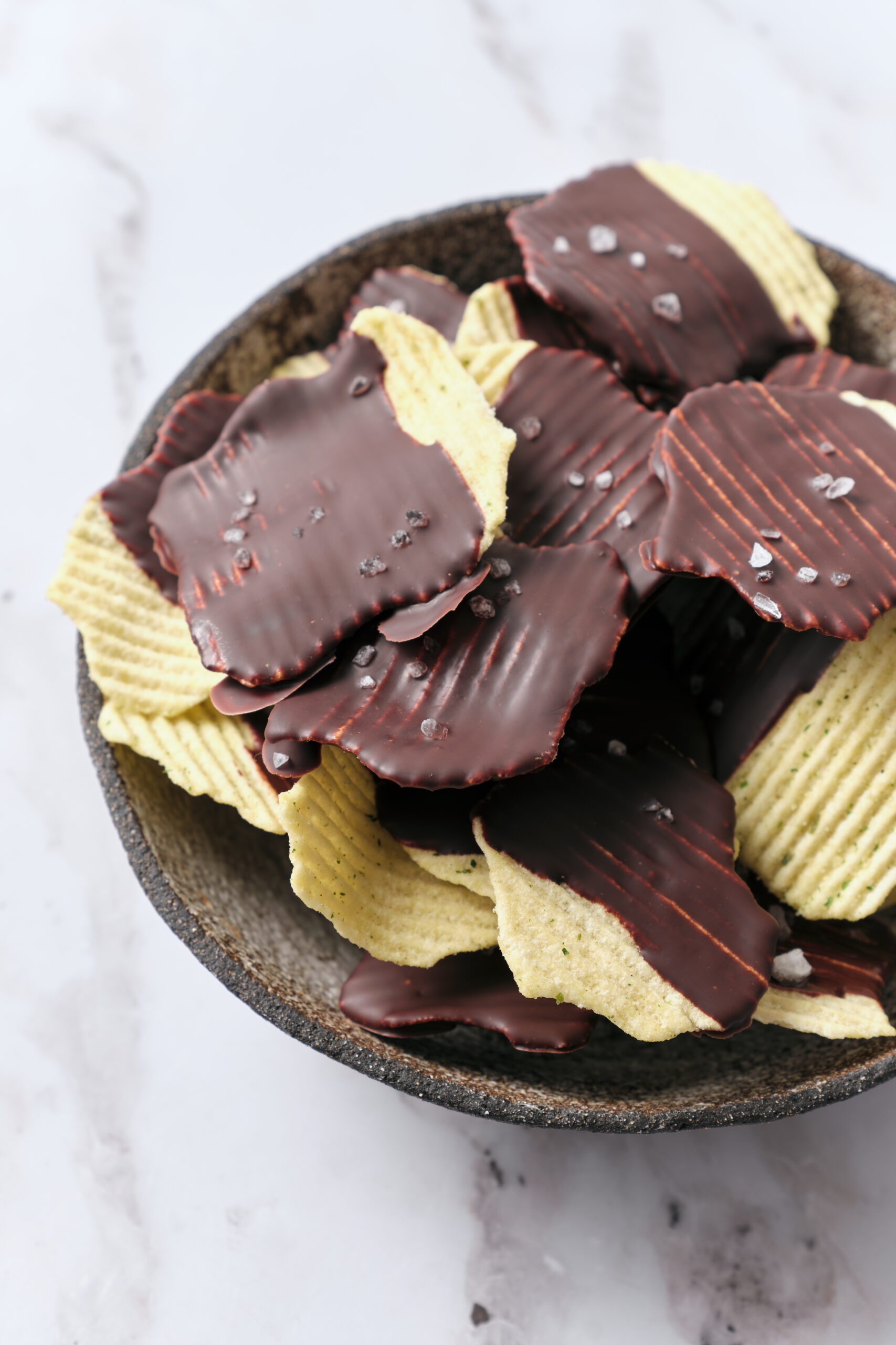 Chocolate Covered Potato Chips in a bowl shot from above