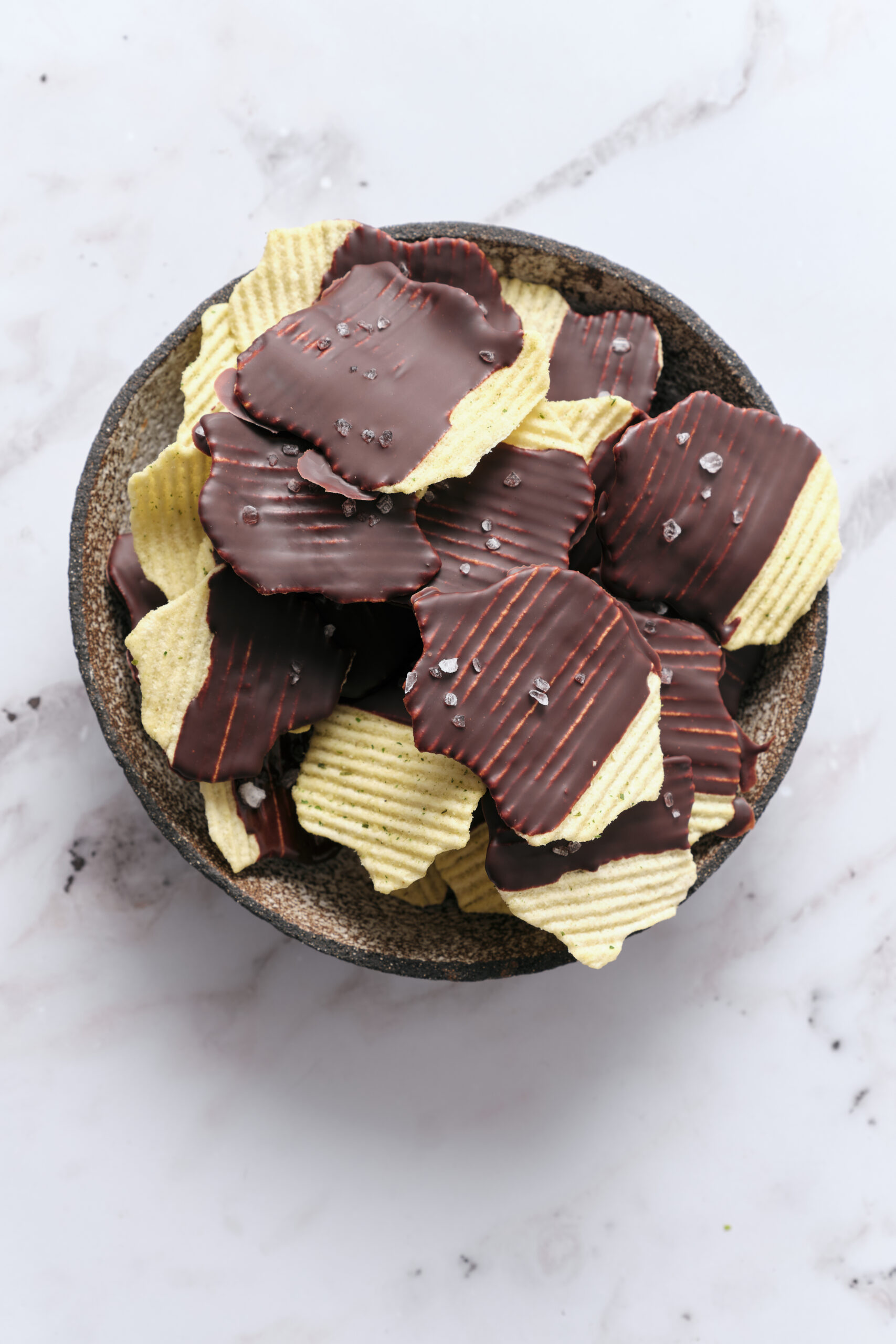 Chocolate Covered Potato Chips in a bowl shot from above